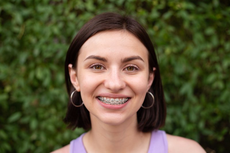 woman wearing braces and standing outside